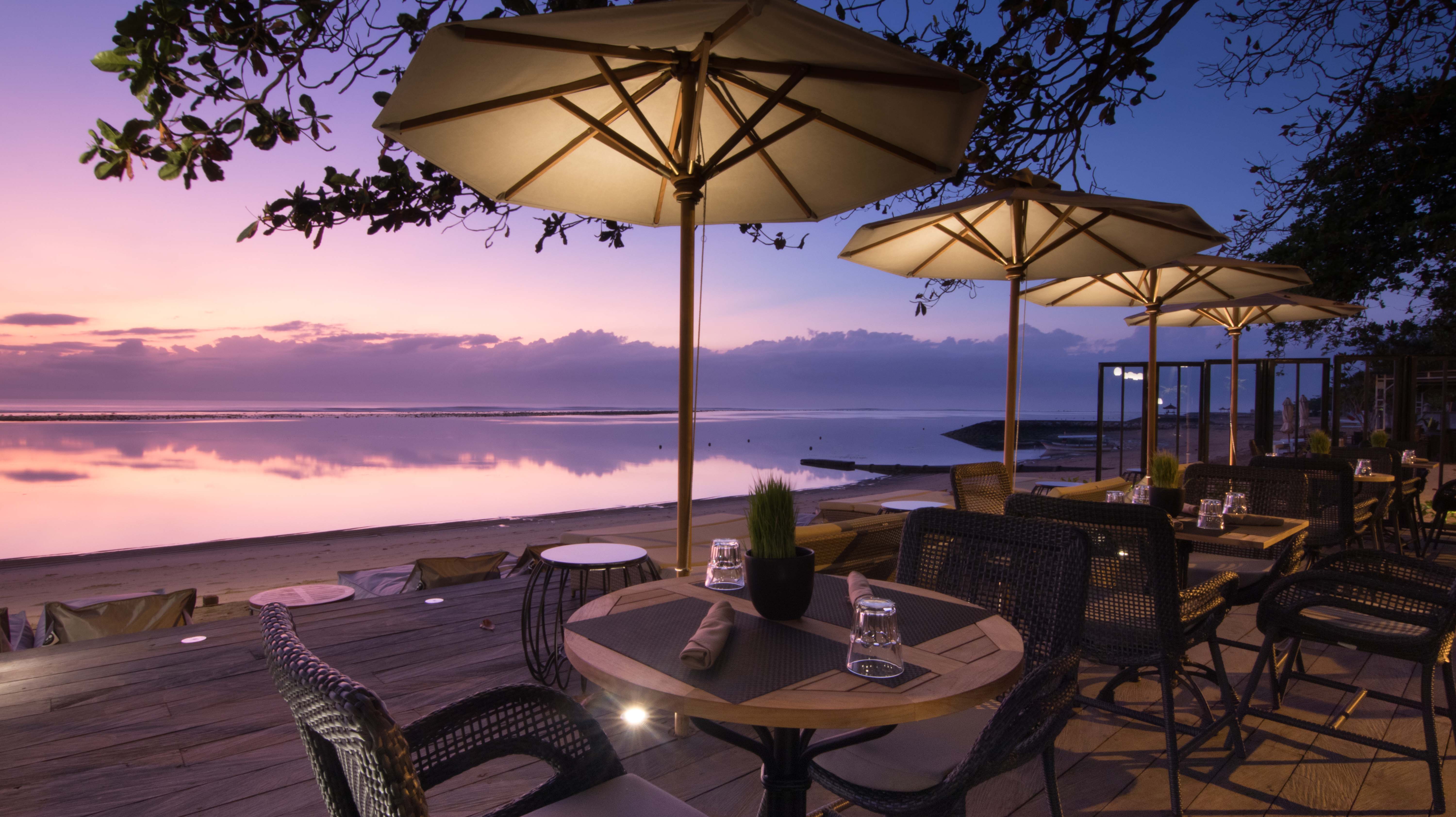 Luxury beachfront dining deck at Kayumanis Seaside Sanur with ocean views